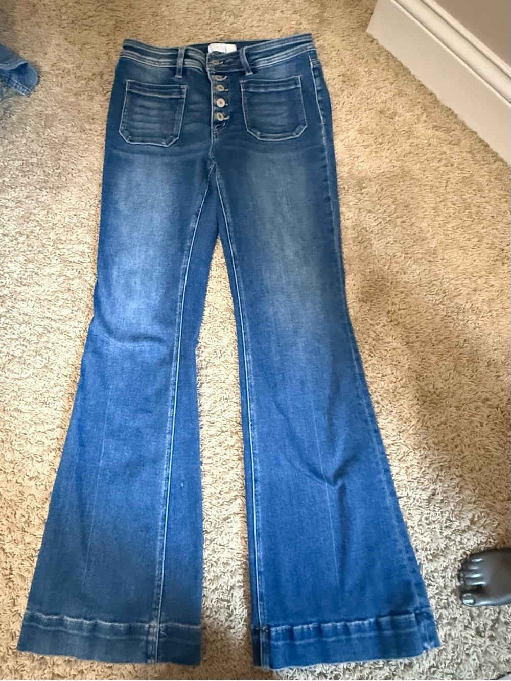 High-Rise Blue Flare Jeans with Exposed Button-Fly